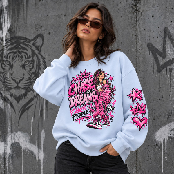 Unisex pastelinis džemperis "Chase dreams, not people"